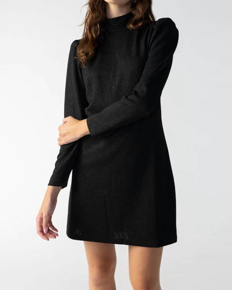 Front of a model wearing a size large Jewel Button Open Back Dress in Black in Black by Sanctuary. | dia_product_style_image_id:326440